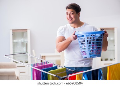 Man Doing Laundry At Home