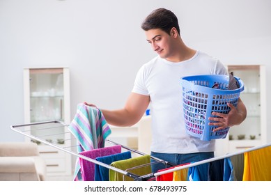 Man Doing Laundry At Home