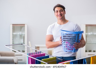 Man Doing Laundry At Home