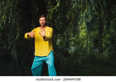 Man Doing Neigong In Nature Near The Foliage