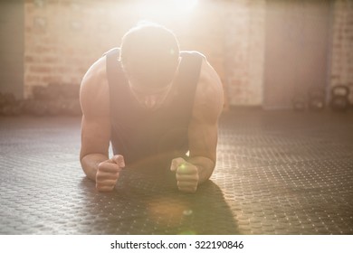 Man Doing Plank Exercise At The Gym