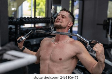 Man doing pull downs at the gym