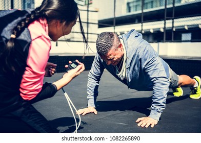 Man doing a push up - Powered by Shutterstock