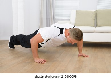 Man Doing Pushup Fitness Exercise At Home