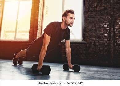 Man doing pushups at the gym