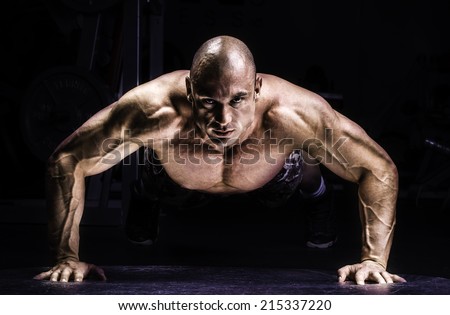 Man Doing Pushups in the gym