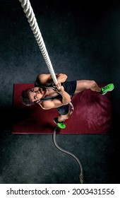 Man Doing Rope Exercise In The Gym