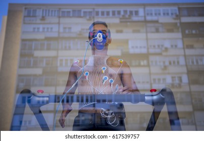 Man doing a stress test of the heart running on a machine