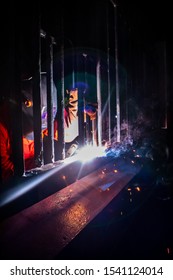 A man doing welding work at night. Hard labor and overtime  