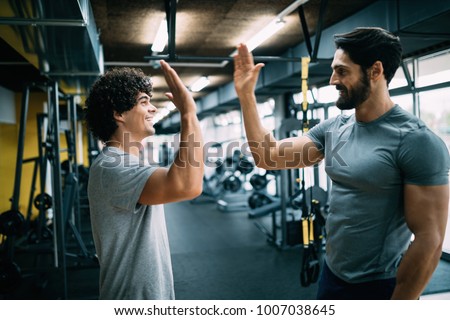 Man doing workout with a personal trainer.