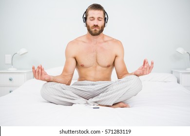 Man Doing Yoga While Listening Music Stock Photo (Edit Now) 571283119