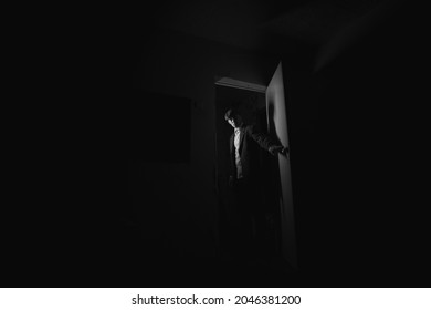 Man In A Doorway In The Dark.