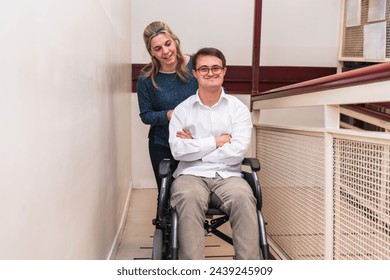A man with Down Syndrome enjoys a companion's push in his wheelchair. - Powered by Shutterstock