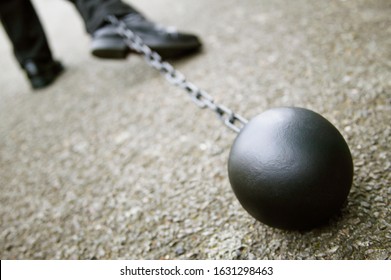 Man Dragging Ball And Chain