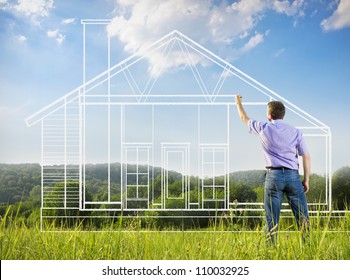 Man drawing a house in a field