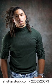 Man With Dreadlocks Isolated On Abstract Background