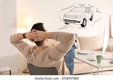 Man dreaming about new car in office during break - Shutterstock ID 1918957883