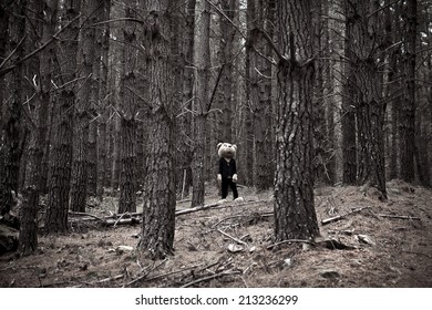 Man Dressed In Bear Suit Standing In Forest