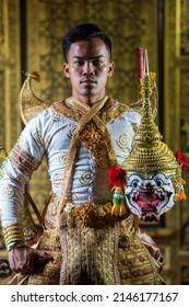 A man dressed in a beautiful pantomime dressed in the character of Khon dancing in a Thai pantomime performance; Khon is traditional dance drama art of Thai classical masked