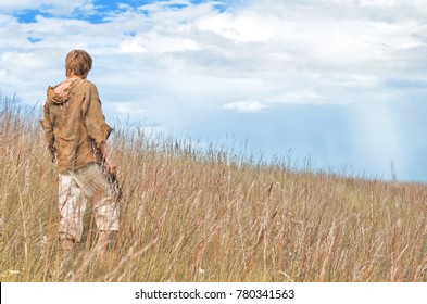 Man Dressed As A Medieval Peasant In The Field