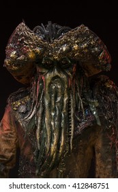 A man dressed in a pirate monster costume, an octopus mask, a beard of tentacles.
