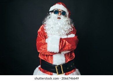 Man Dressed As Santa Claus With Victorian Style Welder Goggles, On Black Background. Concept Of Christmas, Santa Claus, Gifts, Celebration.