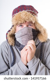 A Man Dressed Snugly In Winter Hat And Scarf