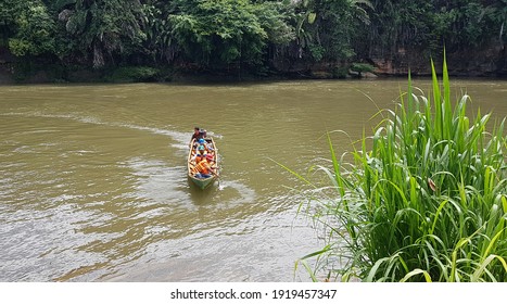 A Man Drifting His Boat On Mentarang River, Malinau, June 9, 2020. Borneo, Indonesia