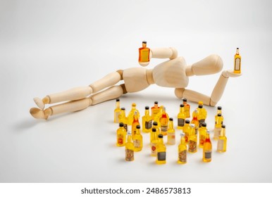 the man with the drink, a wooden mannequin lying down holds drink bottles next to a pile of miniature drink bottles - Powered by Shutterstock