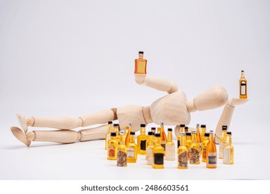 the man with the drink, a wooden mannequin lying down holds drink bottles next to a pile of miniature drink bottles - Powered by Shutterstock