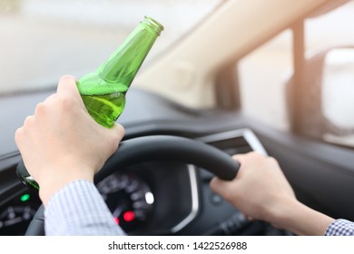 A Man Drinking Alcohol While Driving Drunk Driving Campaign Concept