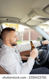 Man drinking alcohol while driving a car. Don't drink and drive concept.
