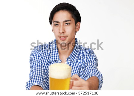 Similar – Image, Stock Photo Portrait of a young man with a beer glass in his hand