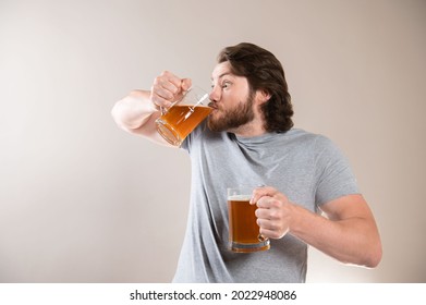 Man Drinking Beer Isolated On Light Gray Background