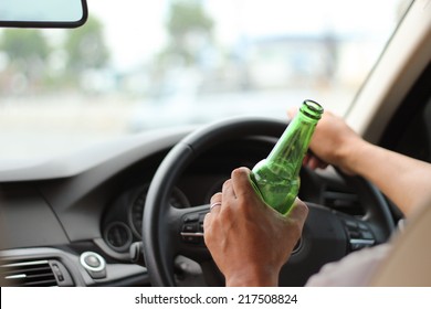 Man Drinking Beer While Driving A Car Don't Drink And Drive Concept. 