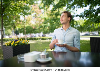 Man drinking a coffee in a cafe