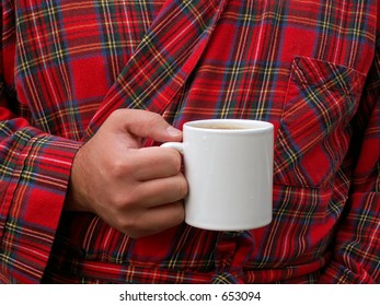 man drinking coffee in his bathrobe