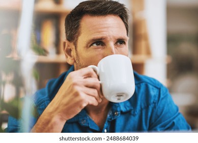 Man, drinking coffee and home for break, relax and comfort with thinking, planning and ideas for travel. Male person, hot beverage and reflection with memory, nostalgia and contemplating for vacation - Powered by Shutterstock