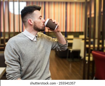 The  man drinking coffee in a restaurant - Powered by Shutterstock