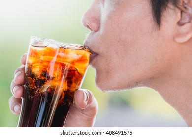 The Man Are Drinking Cola With Ice