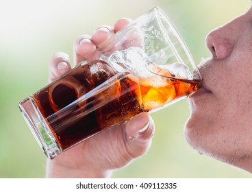 The Man Are Drinking Cola With Ice