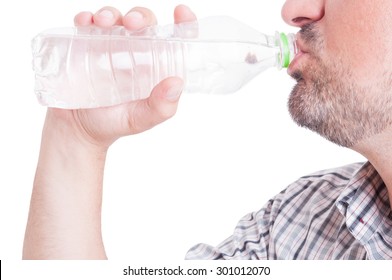 Man Drinking Cold Wather From Plastic Bottle As Summer Heat Or Dehydration Concept