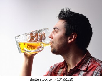 Man drinking a glass of beer - Powered by Shutterstock