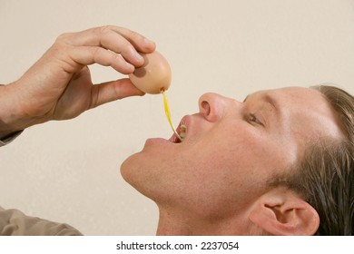 Man Drinking Raw Egg.