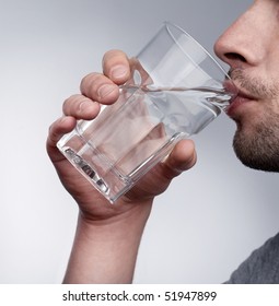 Man Drinking Water Isolated In Studio