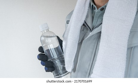 A Man Drinking Water. Workers To Prevent Heat Stroke.