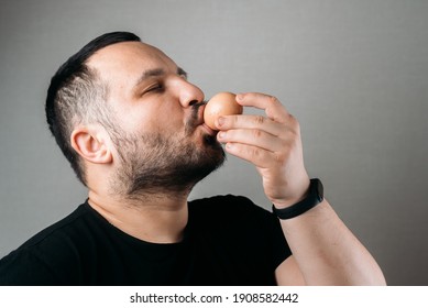 A Man Drinks A Raw Egg