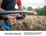 Man with Drip Irrigation Hose – Efficient Watering for Crops