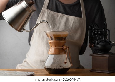 Man Dripping Coffee With Carafe 