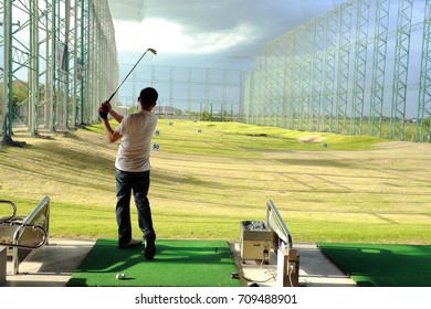 man drive golf at Driving range